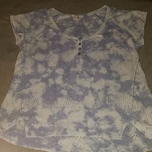 Tshirt with holes throughout. Never worn.
